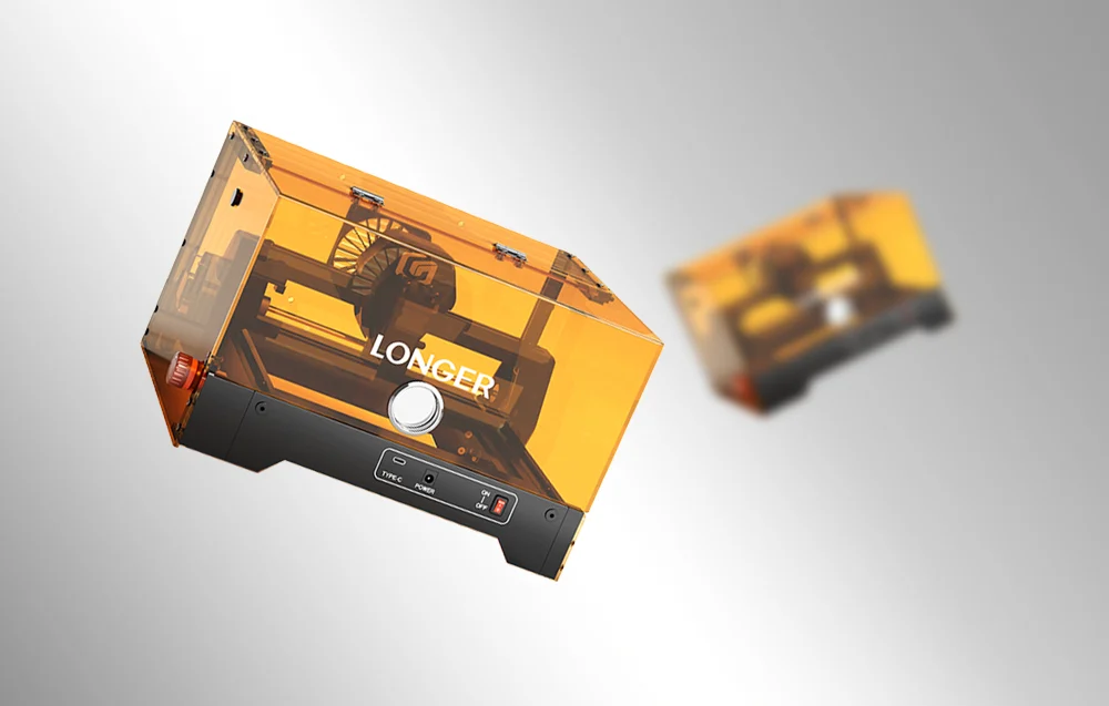 Zamknięta grawerka laserowa Longer Ray5 miniS w charakterystycznej pomarańczowej obudowie ważąca 2,89 kg.